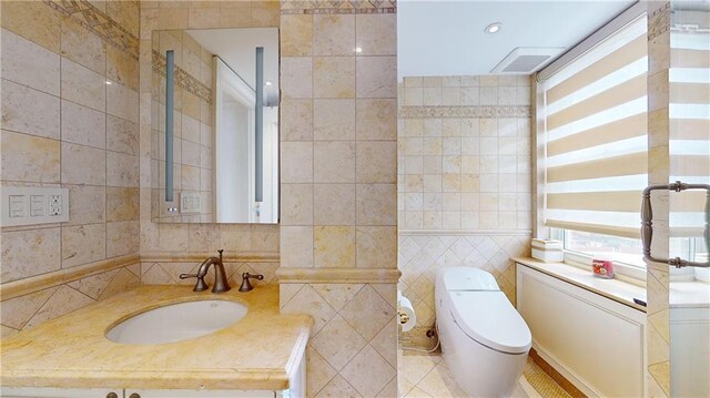 1311 Brightwater Ave Unit 8De, Brooklyn, NY 11235 - bathroom with tile walls, toilet, and vanity