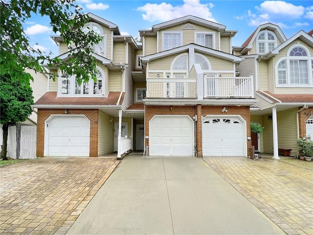50 Chesebrough St, Staten Island, NY 10312 - multi unit property with a garage, driveway, a balcony, and brick siding