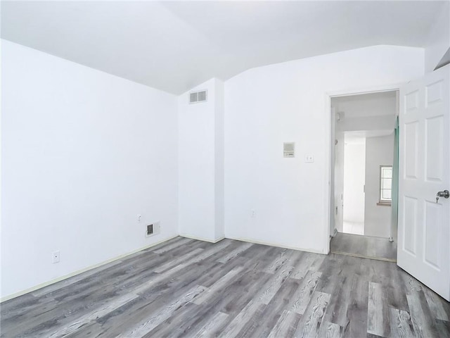 50 Chesebrough St, Staten Island, NY 10312 - unfurnished room featuring wood finished floors and vaulted ceiling