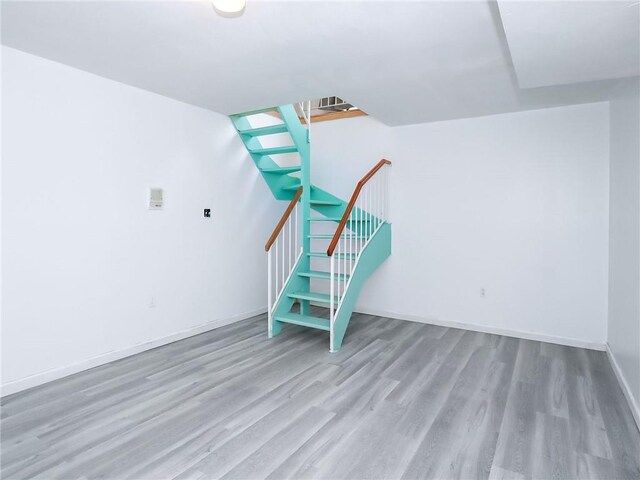 50 Chesebrough St, Staten Island, NY 10312 - unfurnished living room featuring wood finished floors and stairway