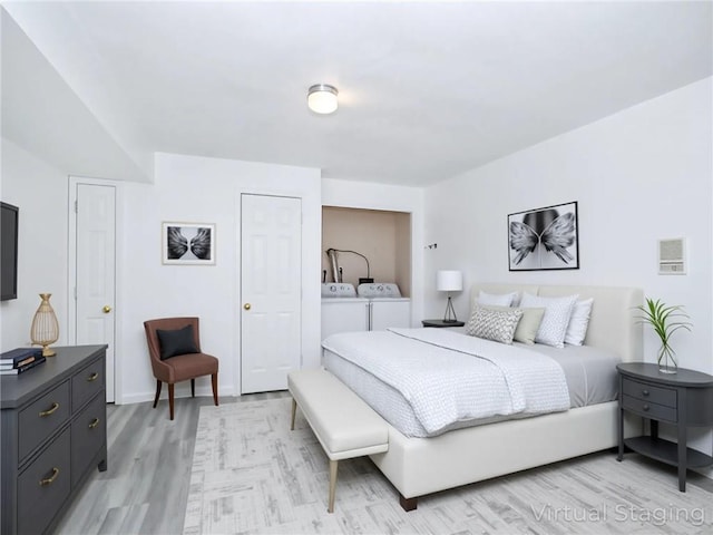 50 Chesebrough St, Staten Island, NY 10312 - bedroom with light wood-style flooring and washing machine and dryer