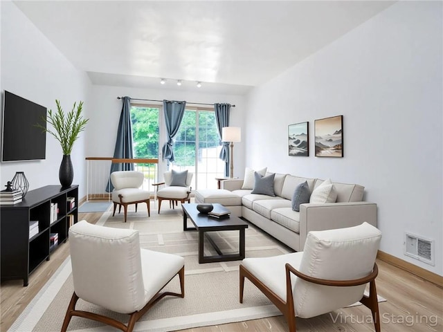 50 Chesebrough St, Staten Island, NY 10312 - living room featuring light wood-style floors and baseboards