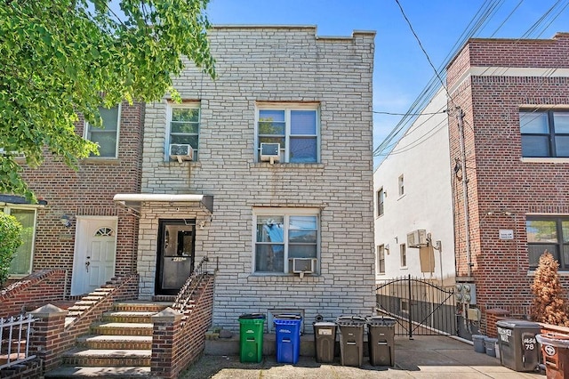 1436 78th St, Brooklyn, NY 11228 - townhome / multi-family property with a gate, cooling unit, and brick siding