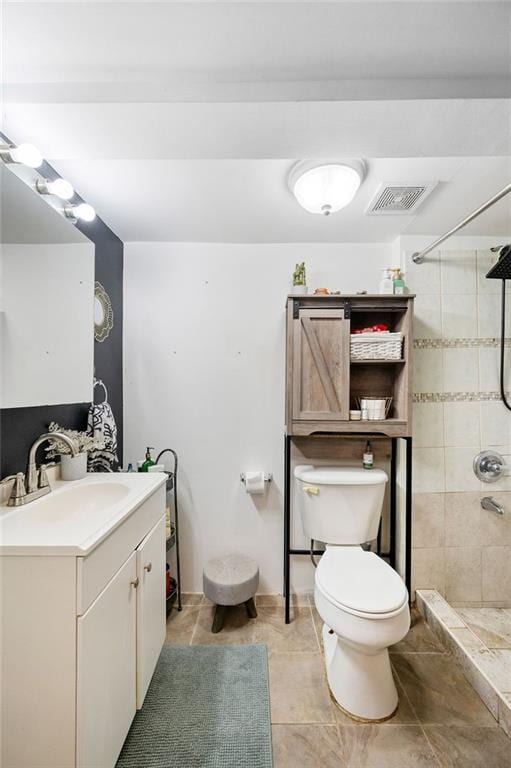 1436 78th St, Brooklyn, NY 11228 - bathroom with vanity, toilet, tiled shower, and tile patterned flooring