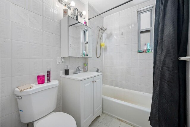 1436 78th St, Brooklyn, NY 11228 - full bath with vanity, toilet, shower / bath combination with curtain, tile walls, and tile patterned floors