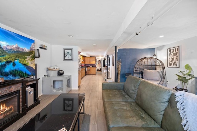 1436 78th St, Brooklyn, NY 11228 - living area with a lit fireplace, light wood-style floors, recessed lighting, and baseboards