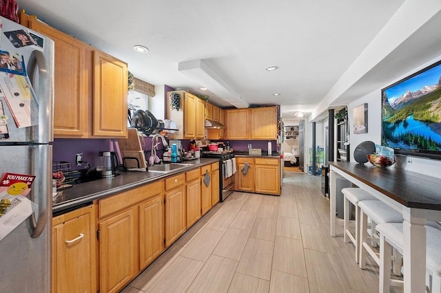 1436 78th St, Brooklyn, NY 11228 - kitchen featuring stainless steel appliances, a sink, dark countertops, recessed lighting, and under cabinet range hood