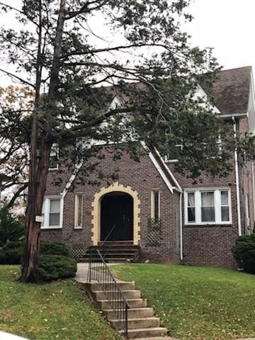 79 Mundy Ave, Staten Island, NY 10310 - english style home featuring brick siding and a front yard
