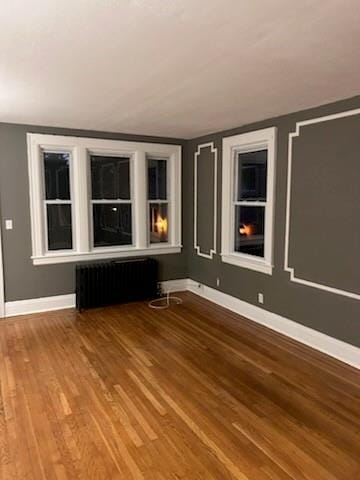 79 Mundy Ave, Staten Island, NY 10310 - empty room featuring radiator heating unit, wood finished floors, and baseboards