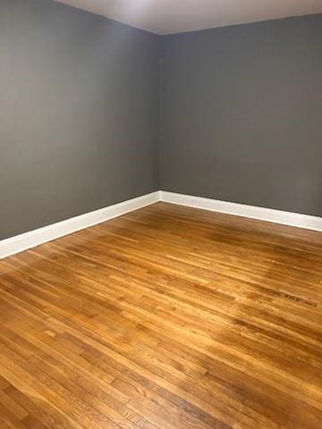 79 Mundy Ave, Staten Island, NY 10310 - spare room featuring wood finished floors and baseboards