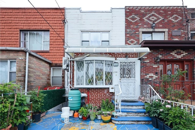2144 W 6th St, Brooklyn, NY 11223 - doorway to property featuring brick siding