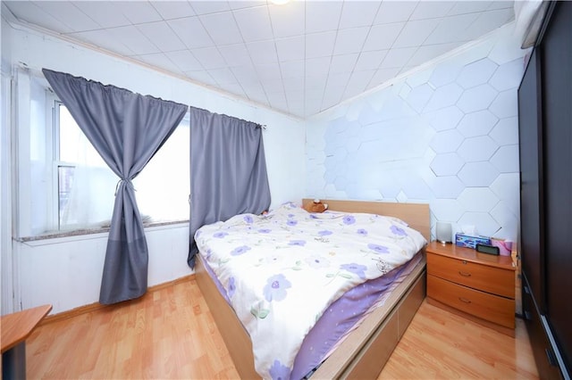 2144 W 6th St, Brooklyn, NY 11223 - bedroom with light wood-style flooring and ornamental molding