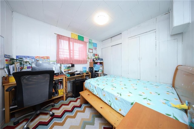 2144 W 6th St, Brooklyn, NY 11223 - bedroom featuring a decorative wall and multiple closets