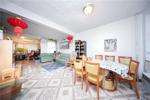 2144 W 6th St, Brooklyn, NY 11223 - dining room with a textured ceiling and a wall unit AC
