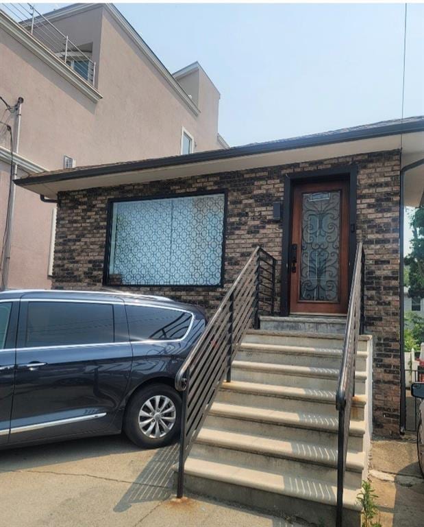 2823 Batchelder St, Brooklyn, NY 11235 - entrance to property with stucco siding and brick siding