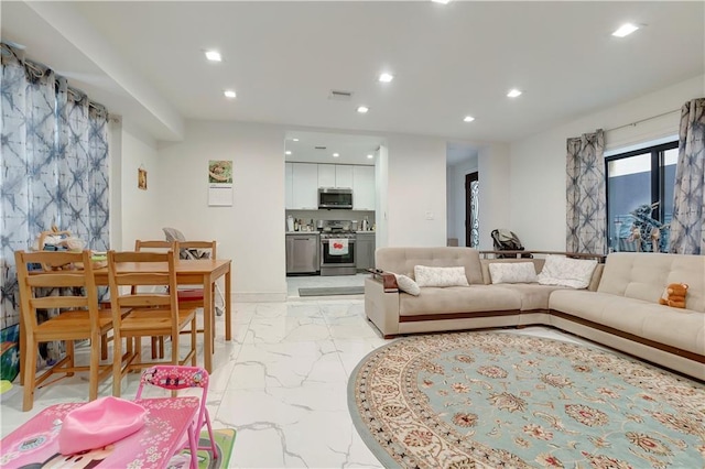 2823 Batchelder St, Brooklyn, NY 11235 - living room featuring recessed lighting and light marble finish floors