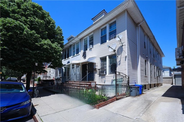 2123 71st St, Brooklyn, NY 11204 - townhome / multi-family property with a fenced front yard and cooling unit