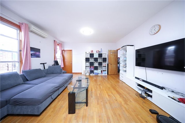 2123 71st St, Brooklyn, NY 11204 - living room featuring a wall mounted AC, healthy amount of natural light, and light wood-style floors