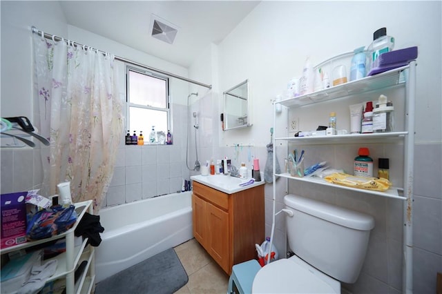2123 71st St, Brooklyn, NY 11204 - full bath featuring vanity, shower / bath combination with curtain, toilet, tile patterned floors, and tile walls