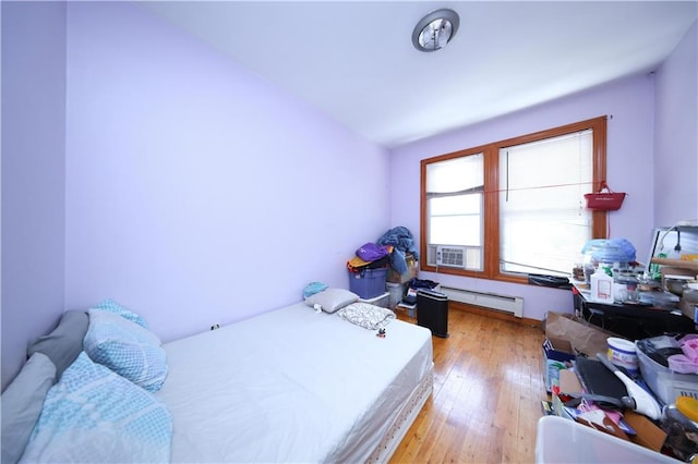 2123 71st St, Brooklyn, NY 11204 - bedroom with a baseboard radiator and light wood-type flooring