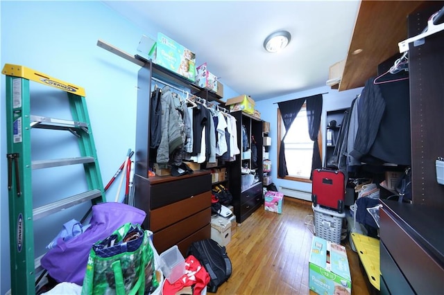 2123 71st St, Brooklyn, NY 11204 - spacious closet with wood finished floors and a baseboard radiator