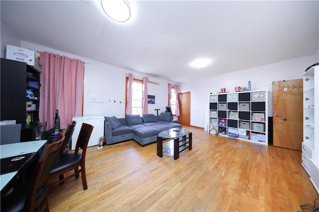 2123 71st St, Brooklyn, NY 11204 - living room featuring a wall mounted air conditioner and hardwood / wood-style floors