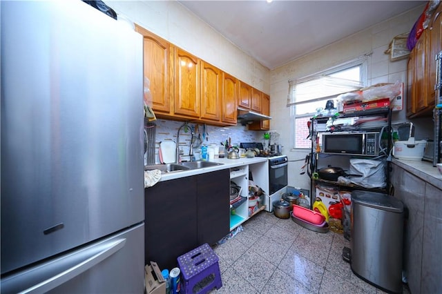 2123 71st St, Brooklyn, NY 11204 - kitchen with freestanding refrigerator, white gas range, black microwave, a sink, and light countertops