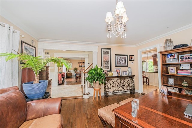 34 Burton Ave, Staten Island, NY 10309 - living room with crown molding, wood finished floors, a chandelier, and ornate columns