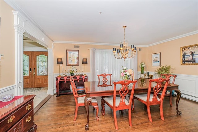 34 Burton Ave, Staten Island, NY 10309 - dining area with a decorative wall, a wainscoted wall, a chandelier, wood finished floors, and ornamental molding