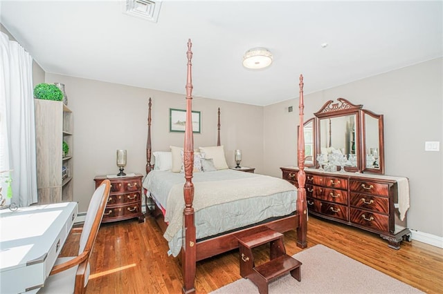 34 Burton Ave, Staten Island, NY 10309 - bedroom featuring wood finished floors and a baseboard heating unit