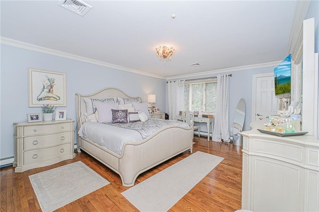 34 Burton Ave, Staten Island, NY 10309 - bedroom featuring ornamental molding, wood finished floors, baseboard heating, and a baseboard heating unit