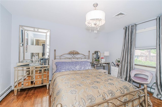34 Burton Ave, Staten Island, NY 10309 - bedroom with wood finished floors, a baseboard heating unit, and a chandelier
