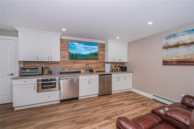 34 Burton Ave, Staten Island, NY 10309 - kitchen featuring stainless steel appliances, a baseboard heating unit, backsplash, white cabinets, and recessed lighting
