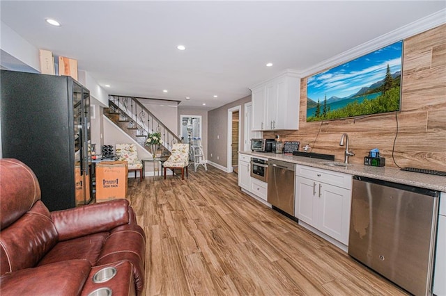 34 Burton Ave, Staten Island, NY 10309 - kitchen featuring stainless steel dishwasher, white cabinets, light wood-type flooring, light stone counters, and recessed lighting