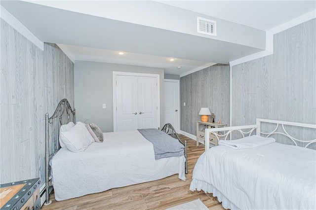 34 Burton Ave, Staten Island, NY 10309 - bedroom featuring wood finished floors, a closet, and wood walls