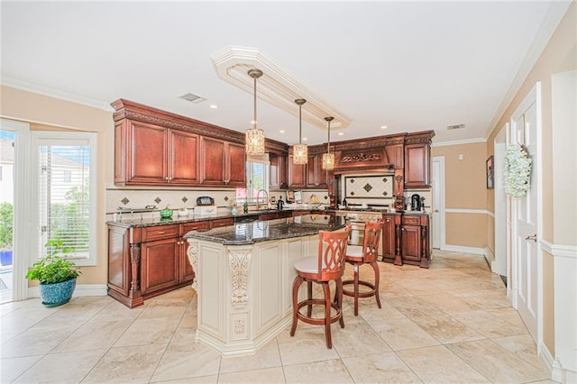 34 Burton Ave, Staten Island, NY 10309 - kitchen with backsplash, a kitchen island, dark stone counters, pendant lighting, and ornamental molding