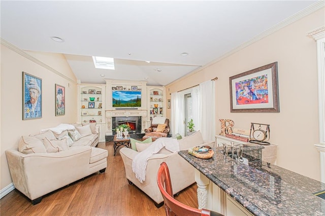 34 Burton Ave, Staten Island, NY 10309 - living room featuring light wood-style flooring, a lit fireplace, lofted ceiling, built in features, and ornamental molding