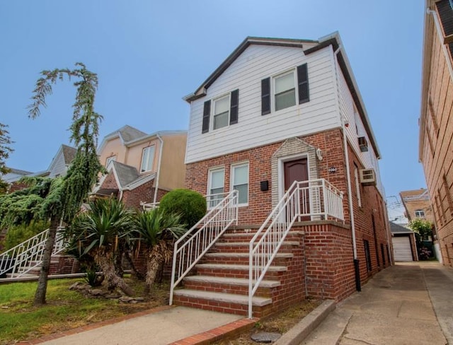 4060 Ocean Ave, Brooklyn, NY 11235 - view of front facade with brick siding, an outbuilding, and a detached garage