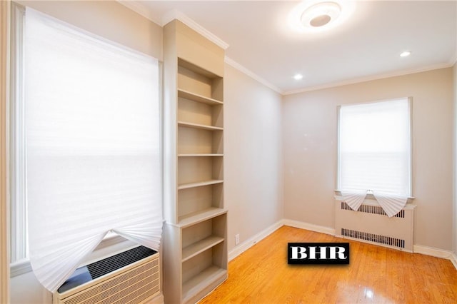 4060 Ocean Ave, Brooklyn, NY 11235 - empty room featuring radiator heating unit, wood finished floors, ornamental molding, and recessed lighting