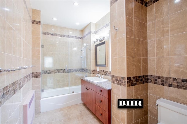 4060 Ocean Ave, Brooklyn, NY 11235 - full bathroom featuring tile walls, enclosed tub / shower combo, vanity, and recessed lighting