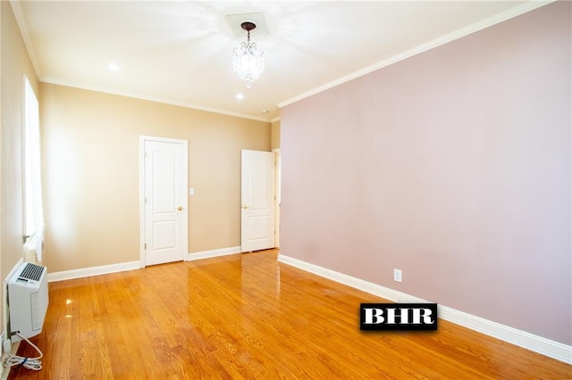 4060 Ocean Ave, Brooklyn, NY 11235 - empty room with light wood finished floors, a chandelier, and ornamental molding