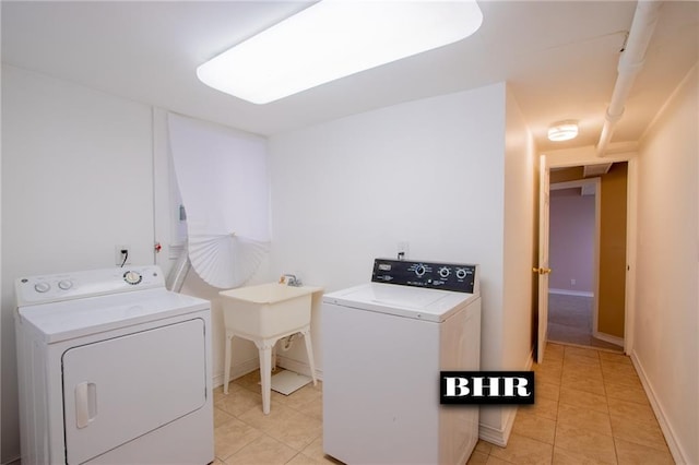 4060 Ocean Ave, Brooklyn, NY 11235 - laundry room with independent washer and dryer and light tile patterned floors