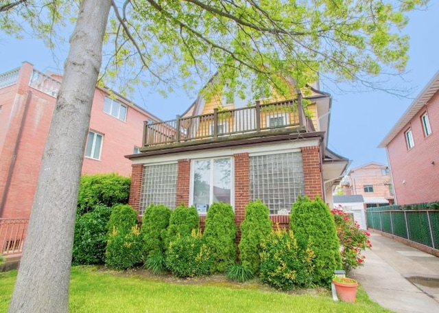 269 Coleridge St, Brooklyn, NY 11235 - view of front of home with a balcony and brick siding