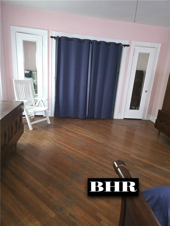 269 Coleridge St, Brooklyn, NY 11235 - unfurnished living room featuring wood finished floors