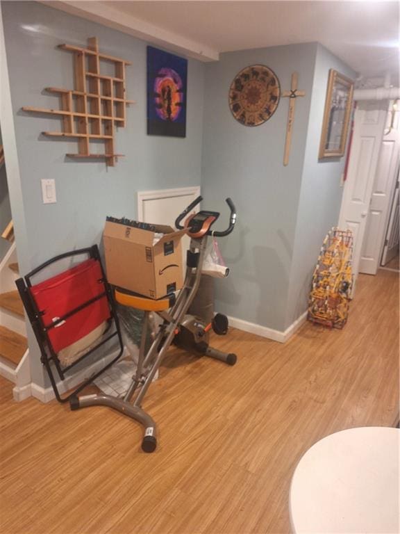 1675 72nd St, Brooklyn, NY 11204 - workout area with baseboards and wood finished floors