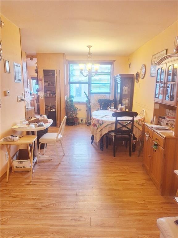 1675 72nd St, Brooklyn, NY 11204 - dining area featuring light wood-style flooring and a chandelier