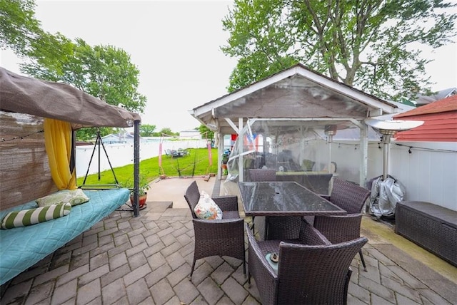 28 Trinity Pl, Staten Island, NY 10310 - fenced backyard featuring a patio, outdoor dining space, and a gazebo