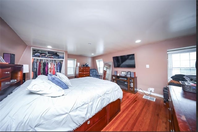 28 Trinity Pl, Staten Island, NY 10310 - bedroom featuring wood finished floors, a closet, multiple windows, and recessed lighting