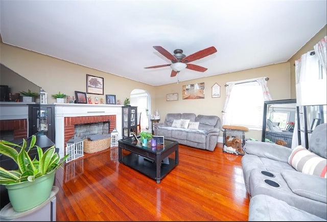 28 Trinity Pl, Staten Island, NY 10310 - living room with a fireplace, a ceiling fan, wood finished floors, and arched walkways