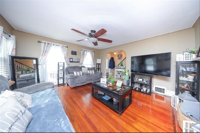 28 Trinity Pl, Staten Island, NY 10310 - living room featuring wood finished floors, a ceiling fan, and arched walkways